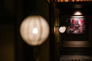 a close up of a light fixture on a wall at The Ritz-Carlton, Chengdu in Chengdu