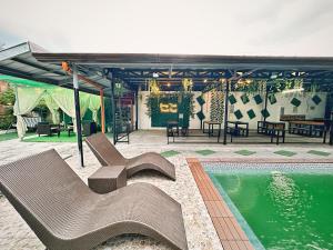 a patio with a pool and chairs and a pavilion at SimoyNorte Private Resort Beneg, Botolan, Zambales, Philippines in Zambales