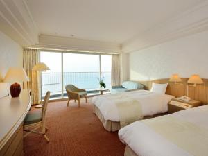 Posteľ alebo postele v izbe v ubytovaní Irago Resort & Convention Hotel