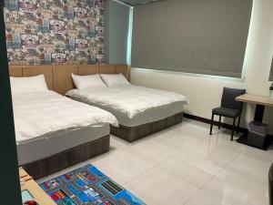 Letto o letti in una camera di 洄游民宿 Migration B&B