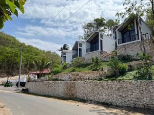 a house on a hill with a stone wall at Naradhipta in Baron