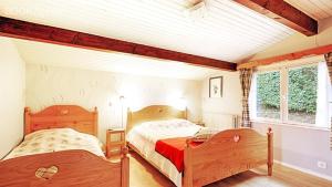 Voodi või voodid majutusasutuse Le Chalet Sous Les Sapins toas