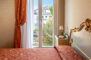 Voodi või voodid majutusasutuse Hotel Rigel toas