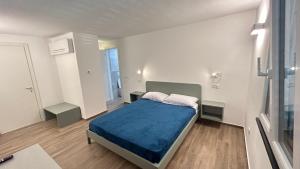 Postel nebo postele na pokoji v ubytování Affittacamere MontAle