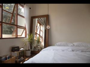 Postel nebo postele na pokoji v ubytování เผลอสุขใจ Cafe and Bad - Plursukjai