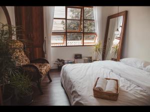 Postel nebo postele na pokoji v ubytování เผลอสุขใจ Cafe and Bad - Plursukjai