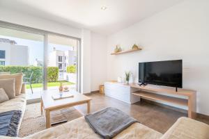 Un televizor și/sau centru de divertisment la Apartamento Boquer