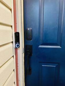 a blue door on the side of a house at Family and Pet Friendly Stay - 15 Min to Downtown Six Flags SeaWorld very close to hospitals in San Antonio