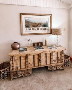 a wooden desk in a room with a mirror at Fugitives Drift Guest House in Rorkeʼs Drift