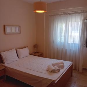Postel nebo postele na pokoji v ubytování Stef Lux Home of Kriopigi