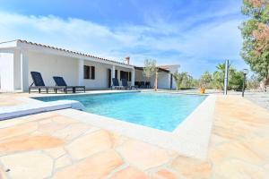 a villa with a swimming pool and a house at Villa della Monica Pure relax in Camisa