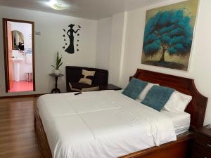 Voodi või voodid majutusasutuse Loreto hotel toas