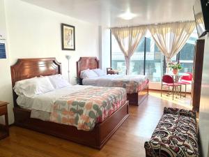Voodi või voodid majutusasutuse Loreto hotel toas