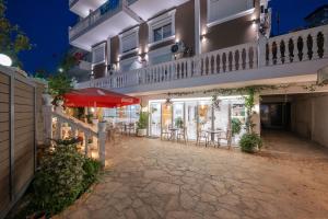 an outdoor patio of a hotel at night at Hotel Elite Sarande in Sarandë