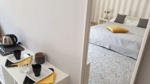 a mirror reflection of a bed in a bedroom at sorrento joy in Sorrento