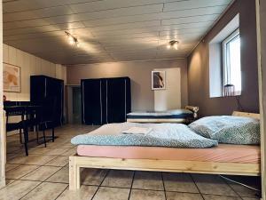 a room with two beds and a table in it at Apartment OchtrUP II Outlet & Zentral in Ochtrup