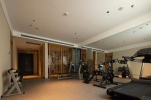 a gym with exercise equipment in a room at Yanyu Yunxi Resort Hotel 烟雨云兮酒店 in Fenghuang County