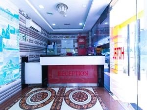 a reception area of a food store with a reception desk at Kuala Selangor Hotel in Kuala Selangor