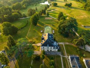 an aerial view of a large house in a park at Garrigae Manoir de Beauvoir Poitiers Sud - Hotel & Spa in Mignaloux-Beauvoir