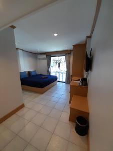 Postel nebo postele na pokoji v ubytování JB House Patong