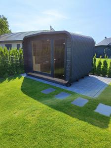 Zahrada ubytování Ferienhaus Devilina mit Sauna und Kamin am Harkebrügger See