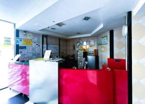a fast food restaurant with a red counter at Bukit Beruntung Hotel in Rawang