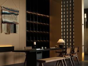 a dining room with a table and chairs at Yanyu Yunxi Resort Hotel 烟雨云兮酒店 in Fenghuang County