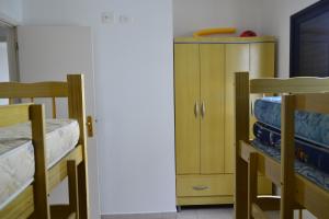 Ένα ή περισσότερα κρεβάτια σε δωμάτιο στο Apartamento Satel Praia