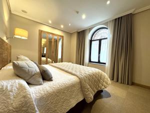Posteľ alebo postele v izbe v ubytovaní Hotel San Juan de los Reyes