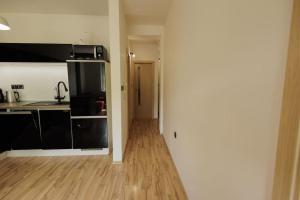 Kuchyňa alebo kuchynka v ubytovaní Moderný apartmán s vlastným parkovaním v blízkosti prírody TOP
