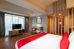 Postelja oz. postelje v sobi nastanitve Ramada by Wyndham Serpong