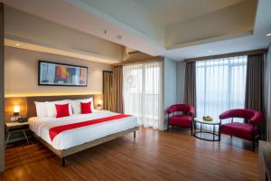 Postelja oz. postelje v sobi nastanitve Ramada by Wyndham Serpong