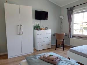 Postel nebo postele na pokoji v ubytování triple a³