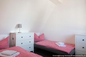 Postel nebo postele na pokoji v ubytování Ferienwohnung in Bodden & Ostsee nähe