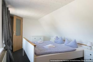 Postel nebo postele na pokoji v ubytování Ferienwohnung in Bodden & Ostsee nähe