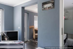 TV a/nebo společenská místnost v ubytování Ferienwohnung in Bodden & Ostsee nähe