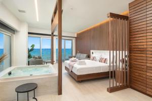 Postel nebo postele na pokoji v ubytování Elia Sea Suites