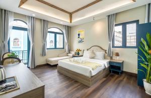 a hotel room with a bed and a couch at Jan Villa SaiGon Oasis in Ho Chi Minh City +73 photos