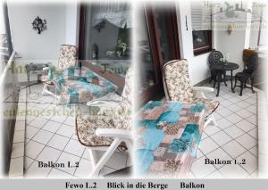 a room with two chairs and a table and a table at Harz Fewo Eulennestchen L2 in Altenau