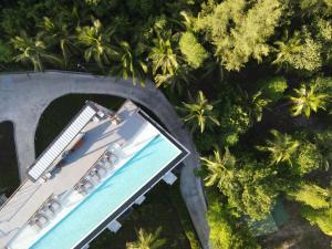 an overhead view of a swimming pool and palm trees at Varivana Resort Koh Phangan, The Centara Collection in Thong Sala +105 photos