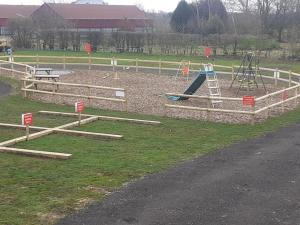 a park with a playground with a slide at Red Lion Holiday Home 1 in Lincolnshire