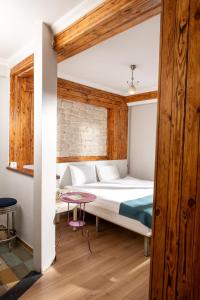 a bedroom with a bed and a table at Hot Budget Ortakoy in Istanbul