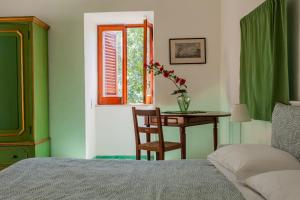 Postel nebo postele na pokoji v ubytování B&b 1787 in Montechiaro
