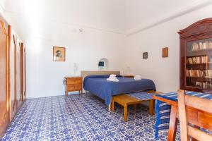 Postel nebo postele na pokoji v ubytování B&b 1787 in Montechiaro