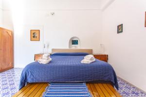 Postel nebo postele na pokoji v ubytování B&b 1787 in Montechiaro