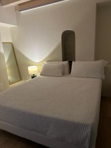 Postel nebo postele na pokoji v ubytování La Ripa Boutique Hotel