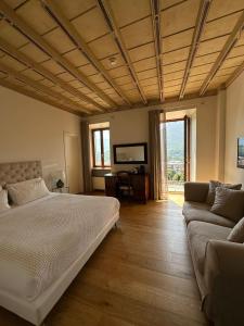 Postel nebo postele na pokoji v ubytování La Ripa Boutique Hotel + 37 fotografií
