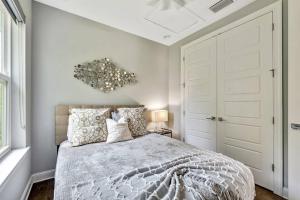 a bedroom with a bed and a chandelier at Luxury Living Superior Home in Prime Tampa Location in Tampa