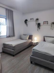 Ένα ή περισσότερα κρεβάτια σε δωμάτιο στο Ferienhaus Luna