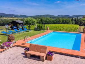 a swimming pool in a yard with a house at Holiday Home Il Poggetto by Interhome in Mercatale Val Di Pesa